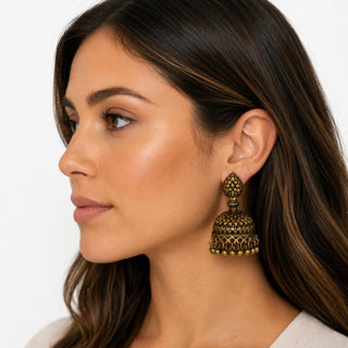 Model wearing Antique Gold Jhumka Earrings — antique gold domed jhumka earring with beaded fringe