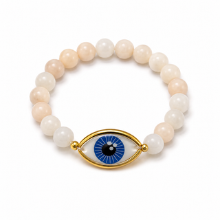 Blush and white agate-tone beaded bracelet with gold-rimmed evil eye charm, close-up