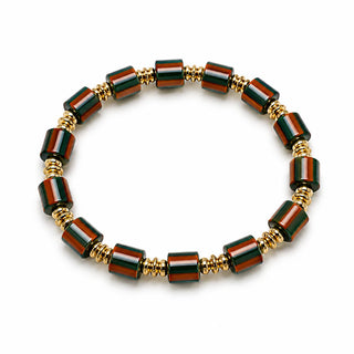 Green and burgundy striped bead stretch bracelet with gold-tone spacers, close-up