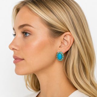 Model wearing Turquoise Halo Stud Earrings — turquoise cabochon stud with turquoise stone halo